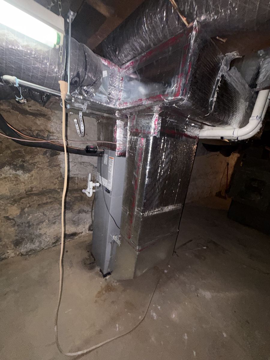 Residential air handler and insulated ductwork in a basement